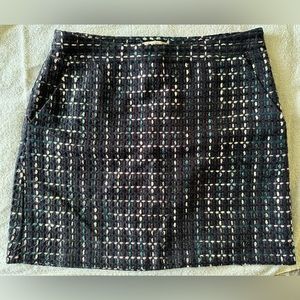 Size 8P Loft mini skirt in multi colors with side zip closure.